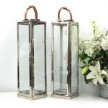 A pair of chromium lanterns