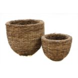 Two large circular wicker plant holders