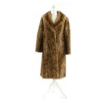 A mink light brown fur coat,