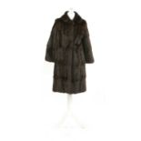 A brown squirrel fur mid length coat,