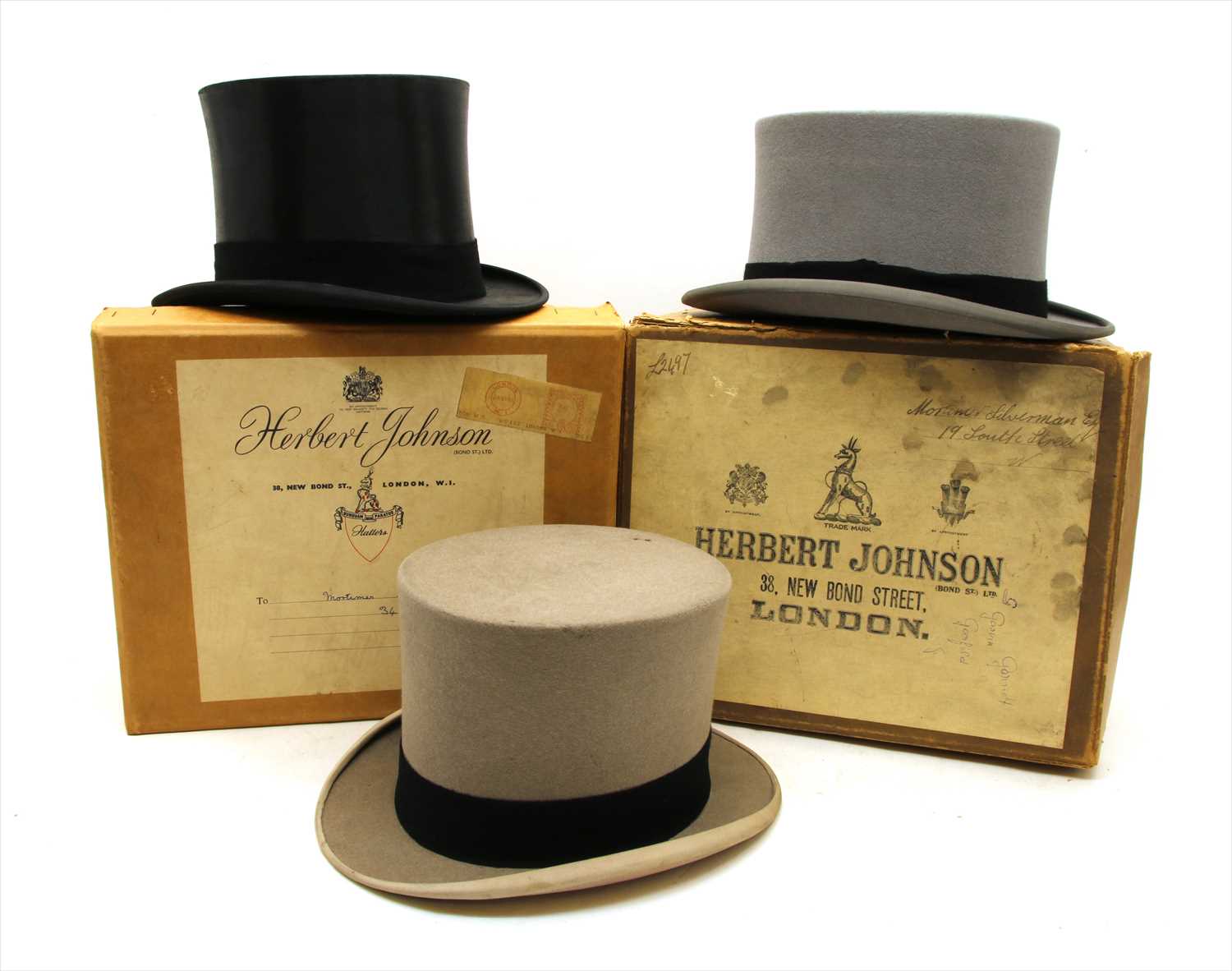 Two Herbert Johnson top hats and one other