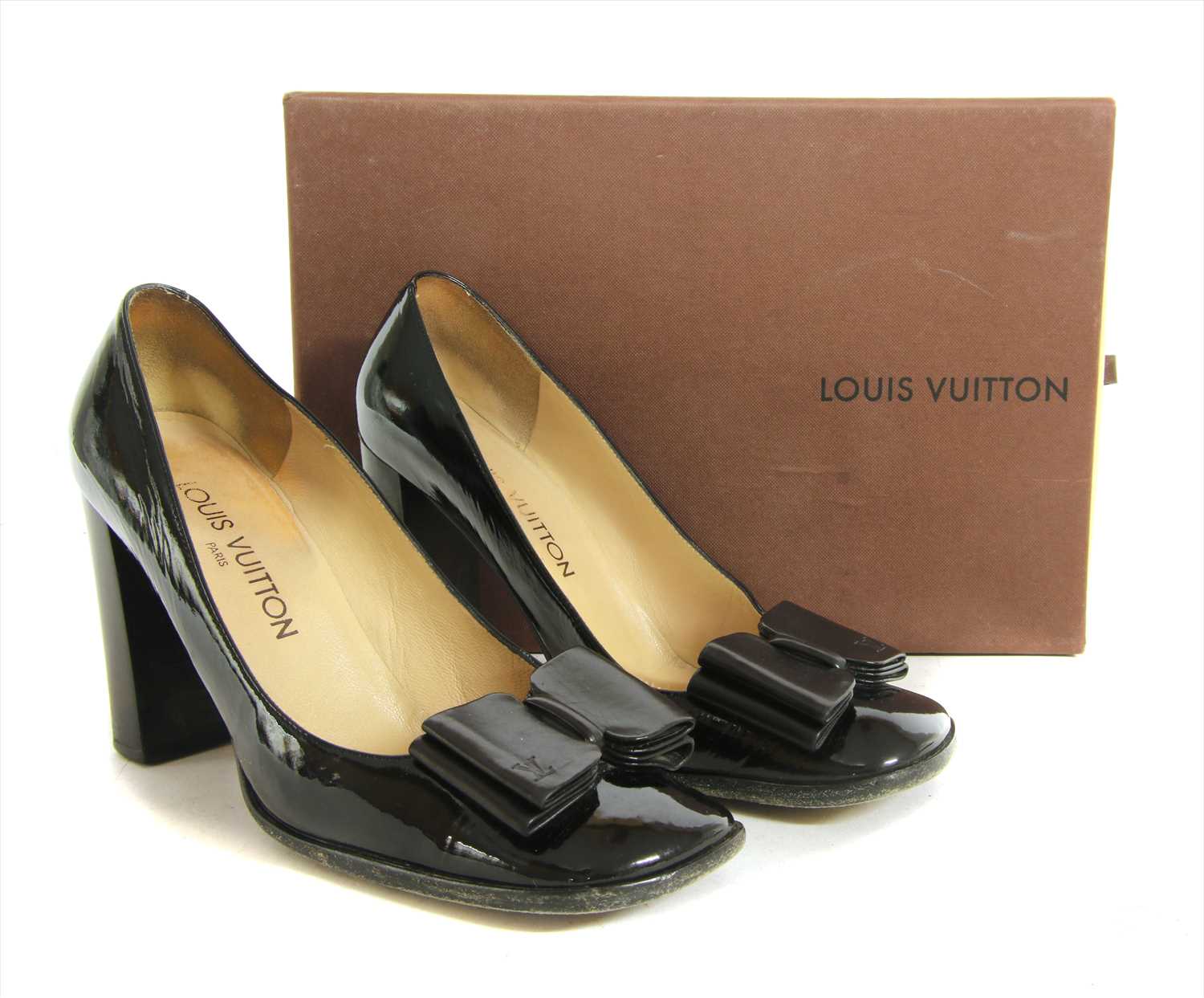 A pair of Louis Vuitton brown patent leather court shoes,