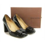 A pair of Louis Vuitton brown patent leather court shoes,