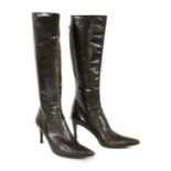 A pair of Gucci brown leather knee-high heeled boots,