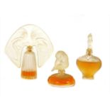 A set of three Lalique Art Nouveau style miniature perfume bottles,