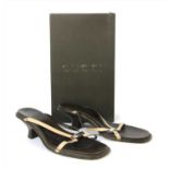 A pair of Gucci strap sandals,