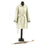 A Burberry mackintosh and umbrella,