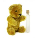 A gold plush teddy bear scent bottle,