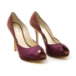 A pair of Christian Dior wine coloured satin and suede heeled peep-toe shoes