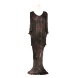 A Charles and Patricia Lester dark purple evening outfit, in the 'Fortuny Style'