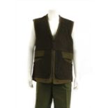 A Harkila gentleman's green and leather brown sporting waistcoat,