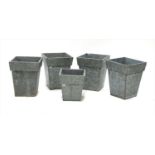 Two pairs of galvanised planters and a square block