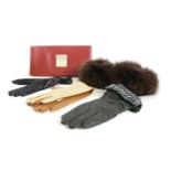 Three pairs of Dents gloves and a pair of fox fur cuffs