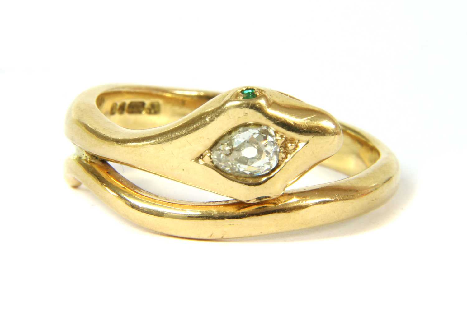 An 18ct gold diamond and emerald snake ring,