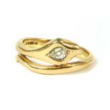 An 18ct gold diamond and emerald snake ring,