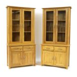 Two modern oak display cabinets