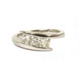An 18ct white gold three stone diamond ring,