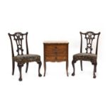 A pair of mahogany side chairs in the manner of Thomas Chippendale