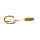 A Tiffany & Co. gold diamond horseshoe stick pin,