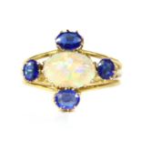 An Edwardian gold opal and garnet topped doublet cinquefoil cluster ring,