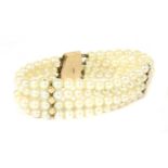 A gold four row uniform cultured pearl bracelet,