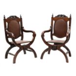 A pair of mahogany 'X' frame open arm chairs,