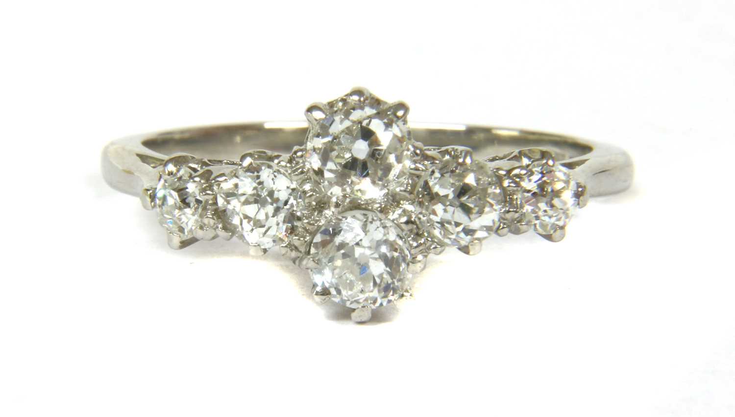 A platinum diamond quatrefoil cluster ring,