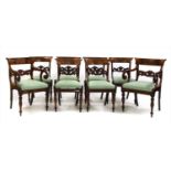 A set of eight George IV mahogany dining chairs