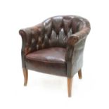 A 19th century brown buttoned leather tub armchair