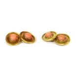 A pair of gold coral cufflinks,