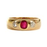 A gold ruby and diamond three stone ring,
