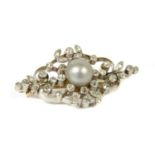 An Edwardian platinum and gold, pearl and diamond brooch,