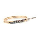 A French 18ct gold diamond, ruby and sapphire bangle, c.1900,