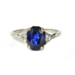 A platinum sapphire and diamond three stone ring,