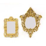 A gilt pierced oval mirror,