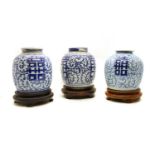 Three Chinese blue and white jars and covers,