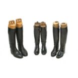 Three pairs of black hunting boots