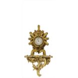 A carved giltwood cased mantel clock,