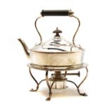 An early 20th Century silver spirit kettle and stand