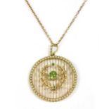 An Edwardian gold peridot and split pearl pendant,