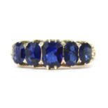 A gold sapphire five stone ring,