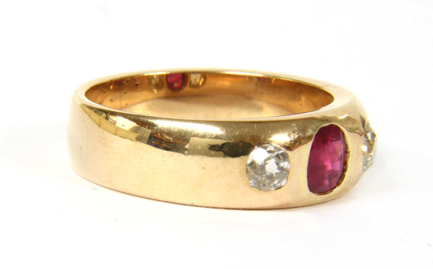 A gold ruby and diamond three stone ring, - Image 3 of 3