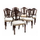 A set of eight Hepplewhite style mahogany shield back dining chairs