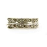 An 18ct white gold diamond half eternity ring,