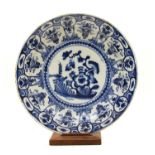 A 19th century blue and white tin glazed charger,