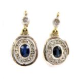 A pair of gold and silver, sapphire and diamond cluster earrings,
