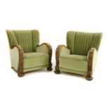 A pair of 'Art Deco' carved oak easy chairs,