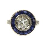 A platinum diamond and sapphire target style cluster ring,