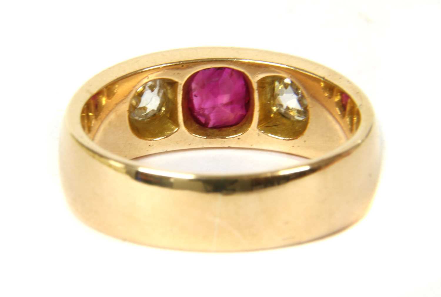 A gold ruby and diamond three stone ring, - Image 2 of 3