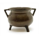 A bronze cauldron,